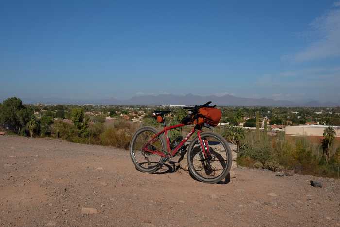A Surly Bridge Club in Papago park overlooking houses and mountains in the distance