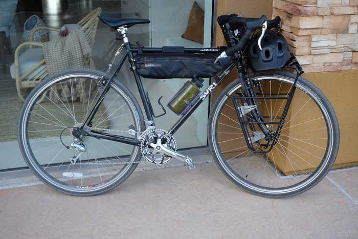 A black Surly Cross-Check leaning against a shop window