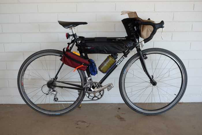 Surly Cross-Check with frame bag, water bottle, hip pack, and donut bag